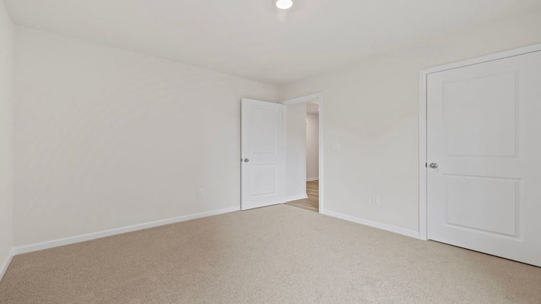 Spacious, unfurnished interior of a new home in Bentley Park, Greenwood (Image 17).