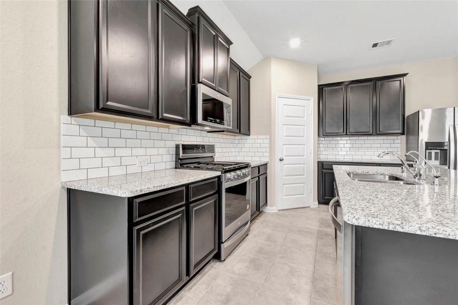 Photo is not of the actual home, but is an inspirational photo of builder’s model home and may depict options, furnishings, and/or decorator features that are not included