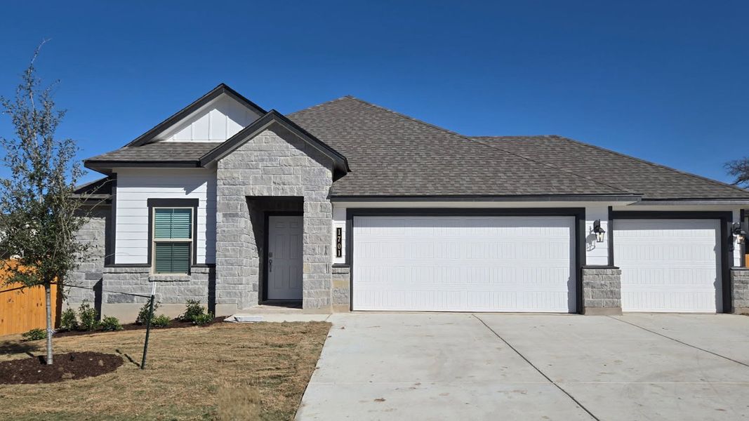 Front exterior of a new home in Village at Nolan Heights, Harker Heights, TX, highlighting curb appeal (Image 1). Front exterior of a new home in Village at Nolan Heights, Harker Heights, TX, highlighting curb appeal (Image 1).