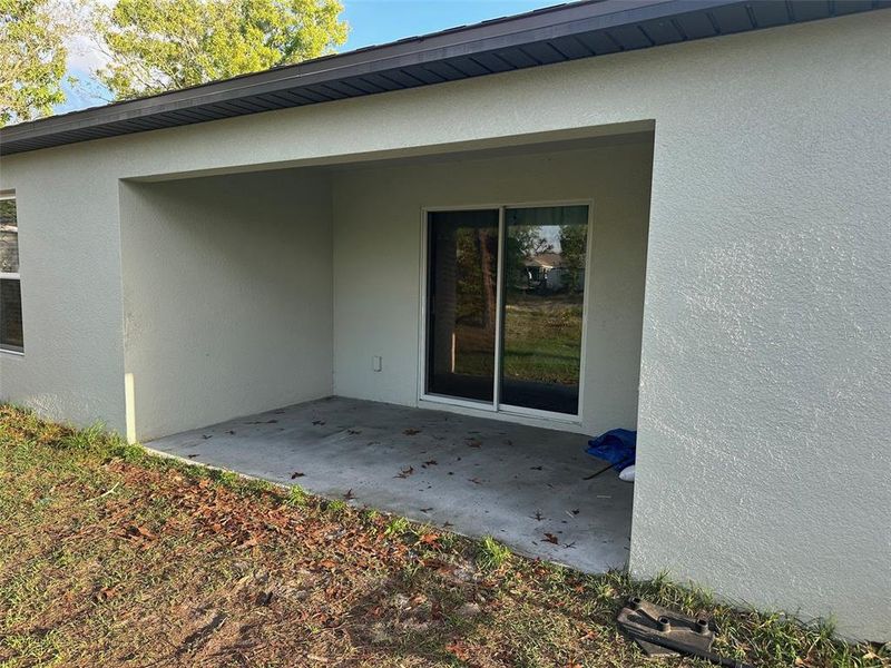 Front exterior of a new home in Spring Hill Classic, Weeki Wachee, FL, highlighting curb appeal (Image 19).