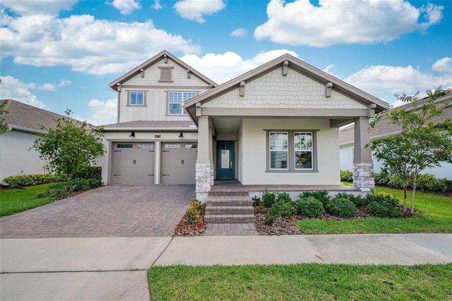 Front exterior of a new home in Laureate Park, Orlando, FL, highlighting curb appeal (Image 1). Front exterior of a new home in Laureate Park, Orlando, FL, highlighting curb appeal (Image 1).