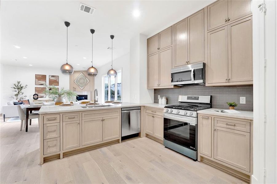 Specious Kitchen with custom cabinets and real stone counter tops.