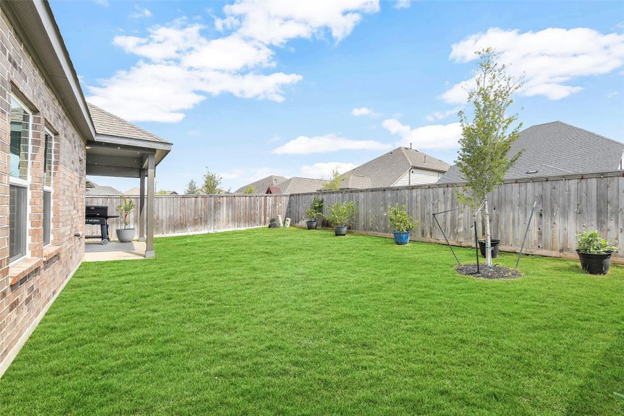 Front exterior of a new home in Bridgeland Creekland Village, Cypress, TX, highlighting curb appeal (Image 18). Front exterior of a new home in Bridgeland Creekland Village, Cypress, TX, highlighting curb appeal (Image 18).