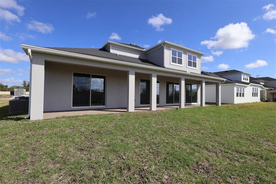 Exterior details and patio area of a home in Wolf Lake Ranch, Apopka (Image 3).