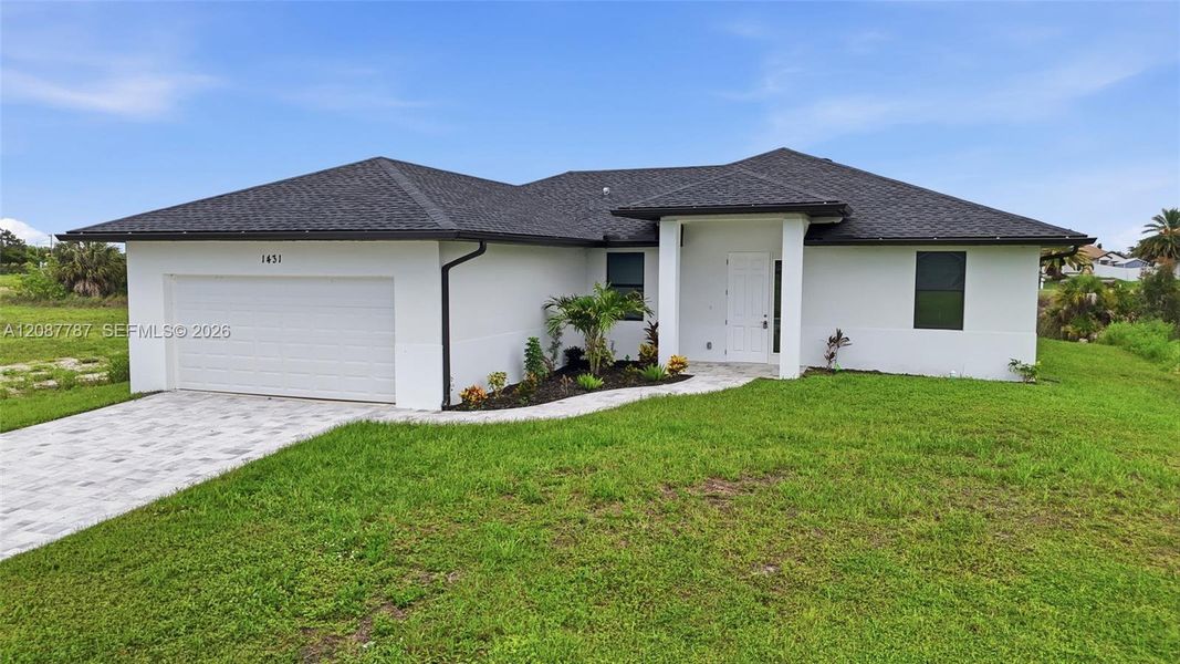 Front exterior of a new home in , Cape Coral, FL, highlighting curb appeal (Image 21). Front exterior of a new home in , Cape Coral, FL, highlighting curb appeal (Image 21).