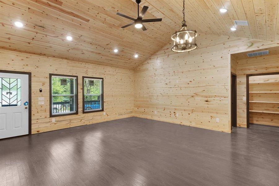 Unfurnished room featuring wood ceiling, wooden walls, and recessed lighting Unfurnished room featuring wood ceiling, wooden walls, and recessed lighting
