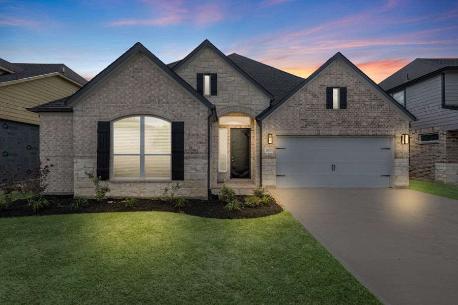 Front exterior of a new home in Morton Creek Ranch, Katy, TX, highlighting curb appeal (Image 1). Front exterior of a new home in Morton Creek Ranch, Katy, TX, highlighting curb appeal (Image 1).