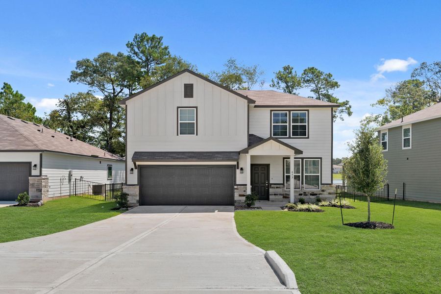Front exterior of a new home in Lakes at Crockett Martin, Conroe, TX, highlighting curb appeal (Image 2). Front exterior of a new home in Lakes at Crockett Martin, Conroe, TX, highlighting curb appeal (Image 2).