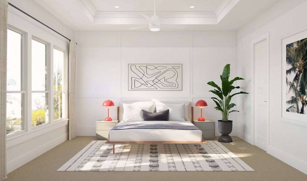 Primary suite with decorative feature wall and tray ceiling