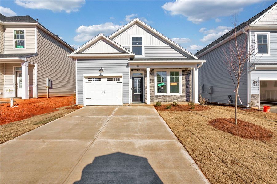 Front exterior of a new home in Brownstone Park, Easley, SC, highlighting curb appeal (Image 2).