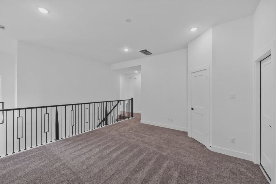 Representative unfurnished interior of a home built from the Versailles by Chesmar Homes in Meridiana Chateau, Manvel (Image 37).