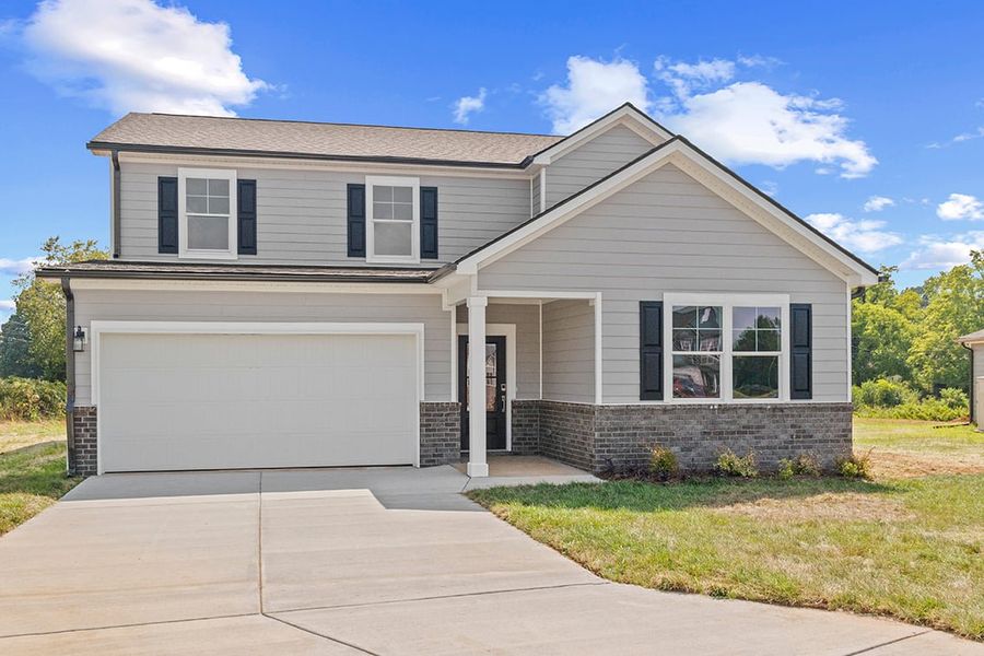 Front exterior of a new home in Barton Hills, Spring Hill, TN, highlighting curb appeal (Image 1).