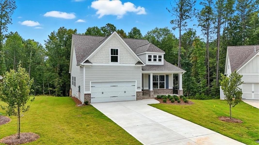 Front exterior of a new home in Stratford at NatureWalk, Dallas, GA, highlighting curb appeal (Image 25). Front exterior of a new home in Stratford at NatureWalk, Dallas, GA, highlighting curb appeal (Image 25).
