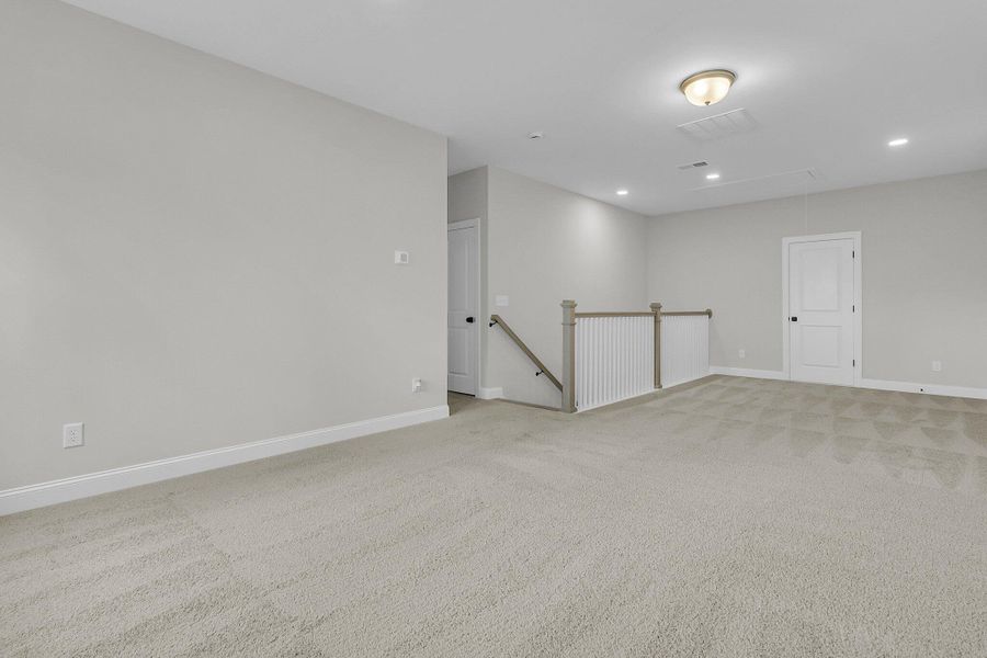Spacious, unfurnished interior of a new home in Tidewater at Lakes of Cane Bay, Summerville (Image 29). Spacious, unfurnished interior of a new home in Tidewater at Lakes of Cane Bay, Summerville (Image 29).