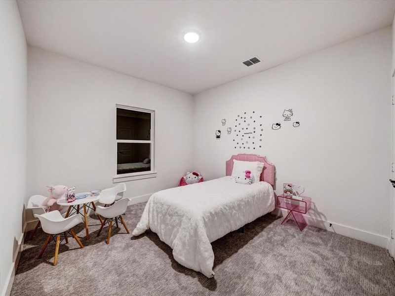 Carpeted bedroom featuring baseboards Carpeted bedroom featuring baseboards