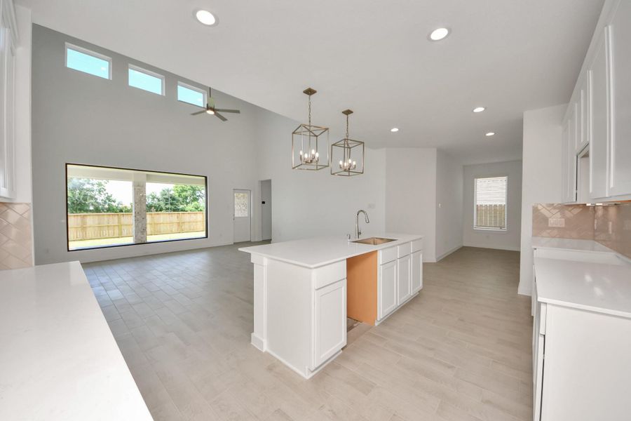 All of this overlooks your expansive family room, creating a perfect space for culinary delights and family gatherings.