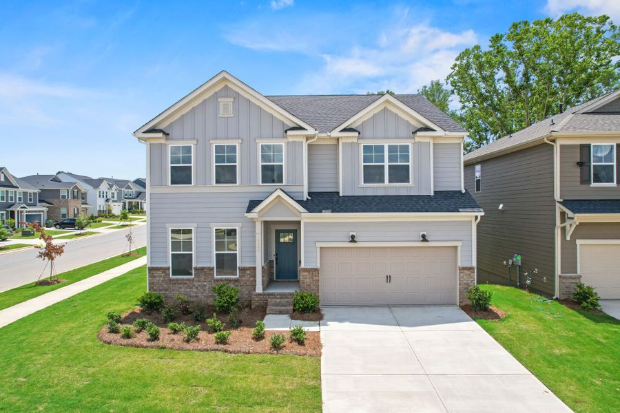 Front exterior of a new home in Cannon Run, Concord, NC, highlighting curb appeal (Image 1).