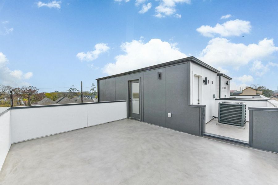 Continue up to the fourth floor to the rooftop deck. Great opportunity for an entertainment space or a place to relax and enjoy the sun.