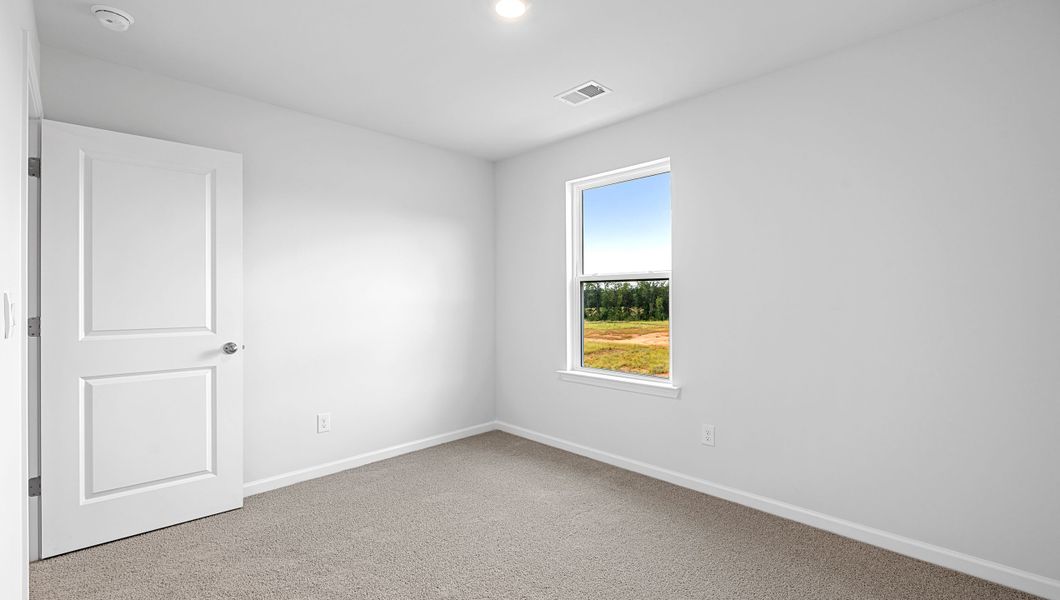 Spacious, unfurnished interior of a new home in Bentley Park, Greenwood (Image 26).