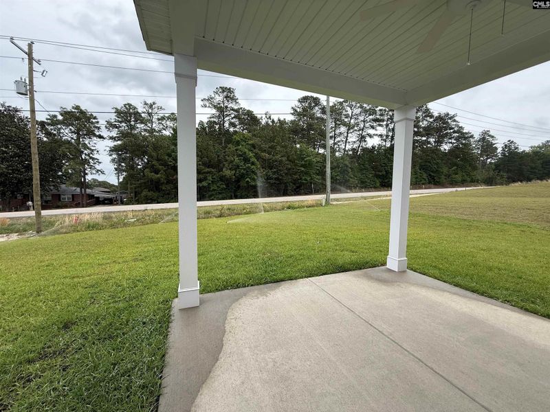 Exterior details and patio area of a home in Cottages at Roofs Pond, West Columbia (Image 3).