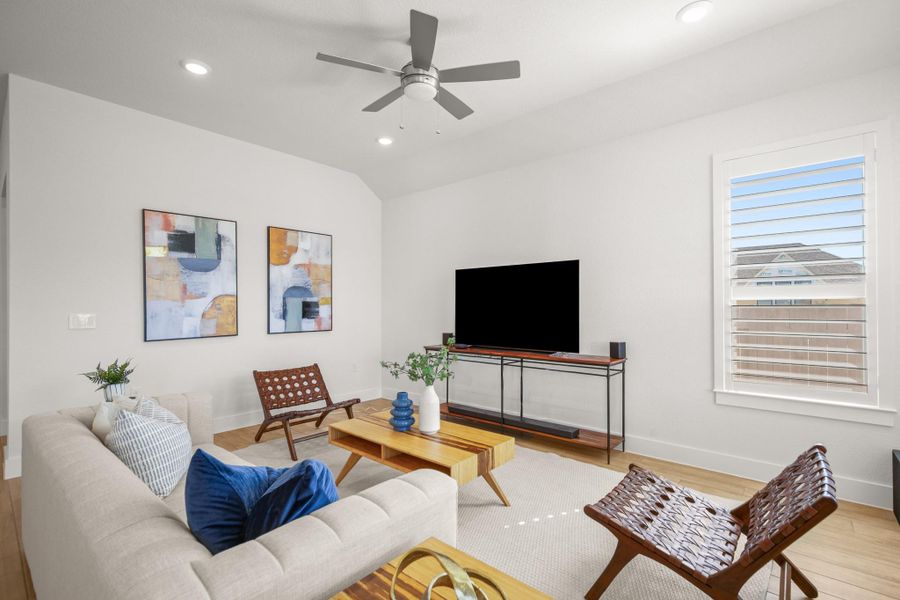 Living area featuring recessed lighting, light wood-style floors, vaulted ceiling, and a ceiling fan