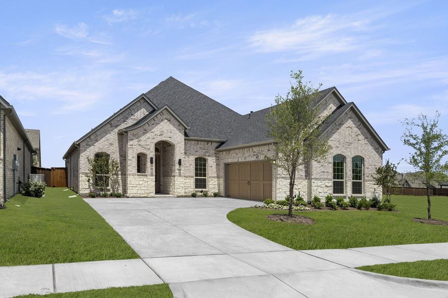 Front exterior of a new home in Nelson Lake Estates, Rockwall, TX, highlighting curb appeal (Image 2). Front exterior of a new home in Nelson Lake Estates, Rockwall, TX, highlighting curb appeal (Image 2).