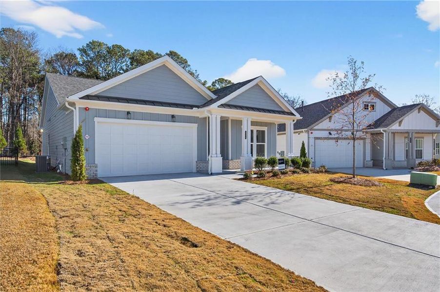 Front exterior of a new home in The Reserve at Bells Ferry, Kennesaw, GA, highlighting curb appeal (Image 20).