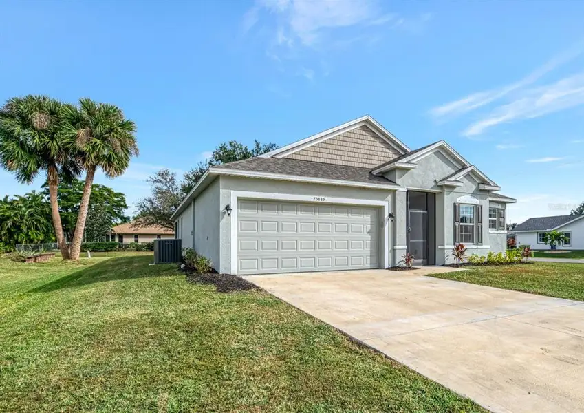 Front exterior of a new home in , Punta Gorda, FL, highlighting curb appeal (Image 2).