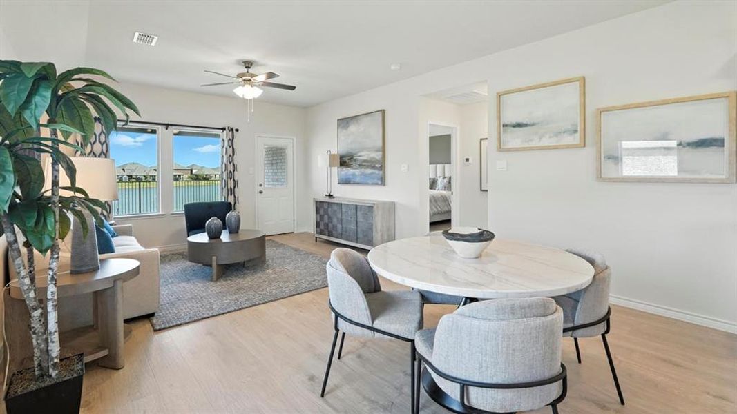 Dining room featuring light wood-style flooring and ceiling fan