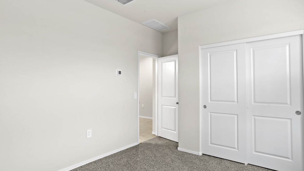 Representative unfurnished interior of a home built from the McCormick by D.R. Horton in Rio Rancho Estates, Surprise (Image 13).