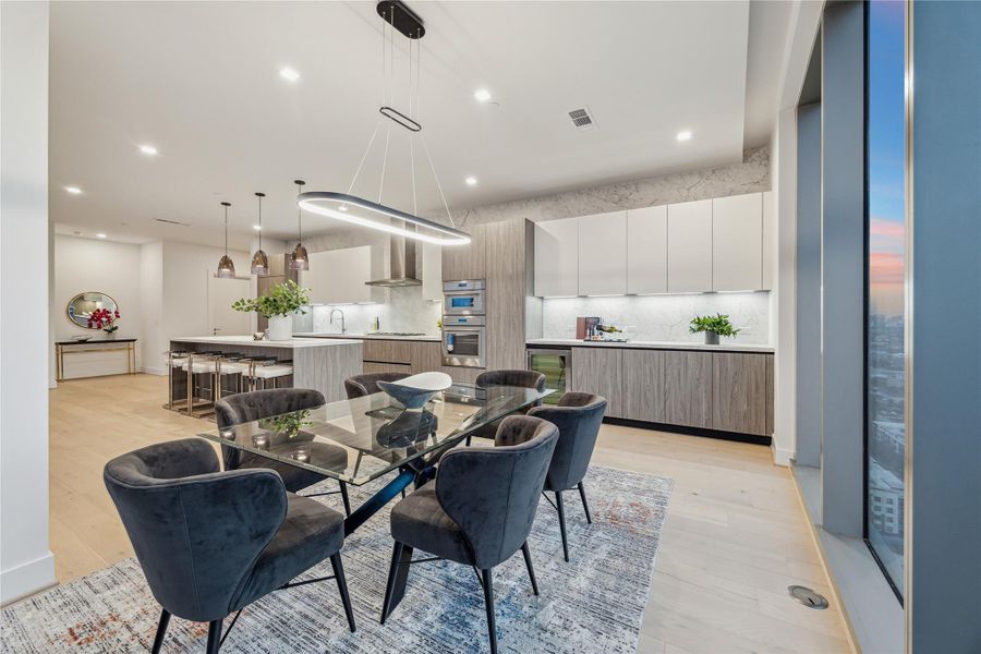 Dining area includes additional built-in storage and a U-Line wine fridge for added convenience. Dining area includes additional built-in storage and a U-Line wine fridge for added convenience.