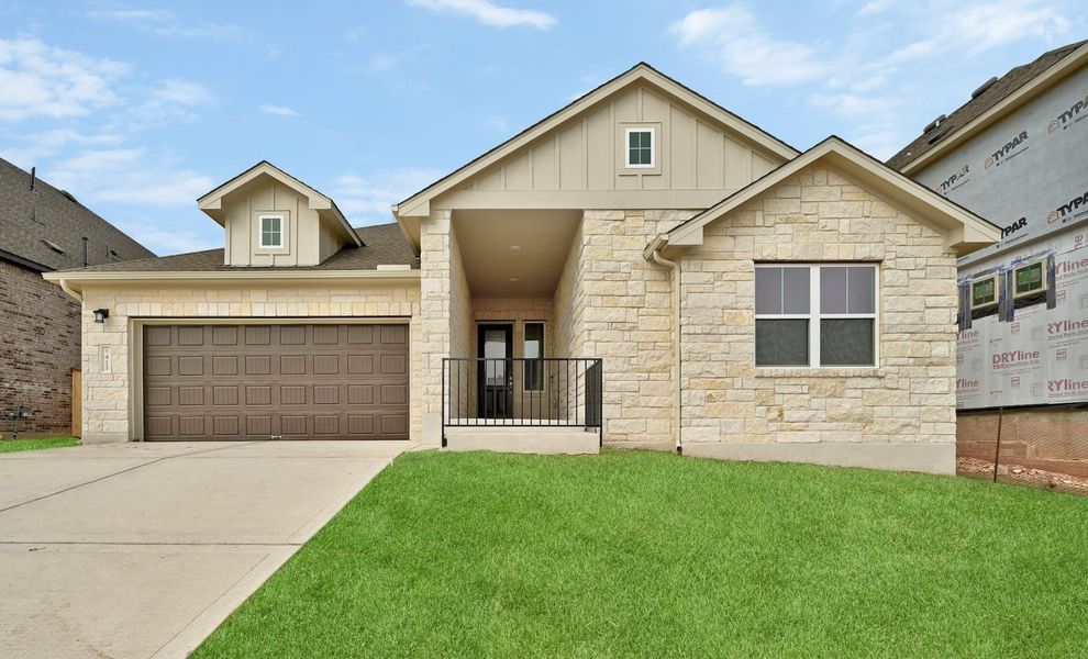 Front exterior of a new home in Anthem, Kyle, TX, highlighting curb appeal (Image 1). Front exterior of a new home in Anthem, Kyle, TX, highlighting curb appeal (Image 1).