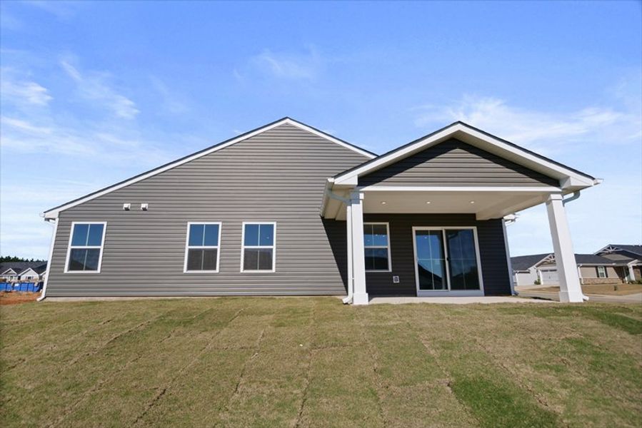 Exterior details and patio area of a home in Reidville Town Center Cottages, Duncan (Image 15).