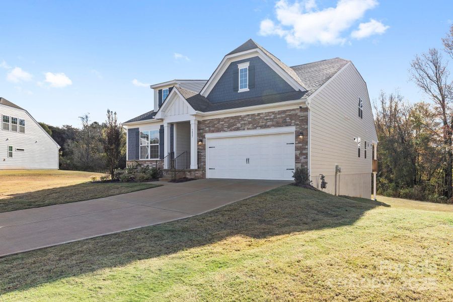 Front exterior of a new home in Bell Farm: 60's, Statesville, NC, highlighting curb appeal (Image 2).