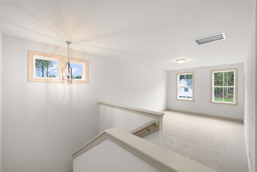 Representative unfurnished interior of a home built from the The Hampton by RobuckHomes in Baylee Ridge, Selma (Image 194).