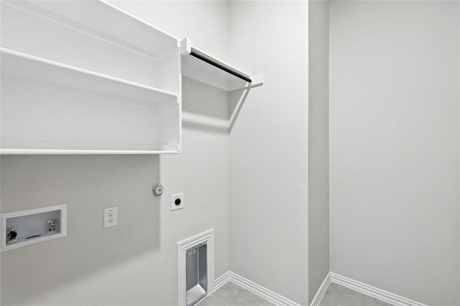 Washroom featuring electric dryer hookup, hookup for a washing machine, and gas dryer hookup