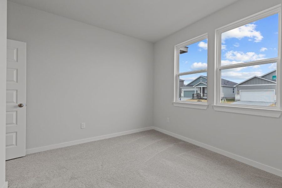 A room with a window and a door with a view of the city. A room with a window and a door with a view of the city.