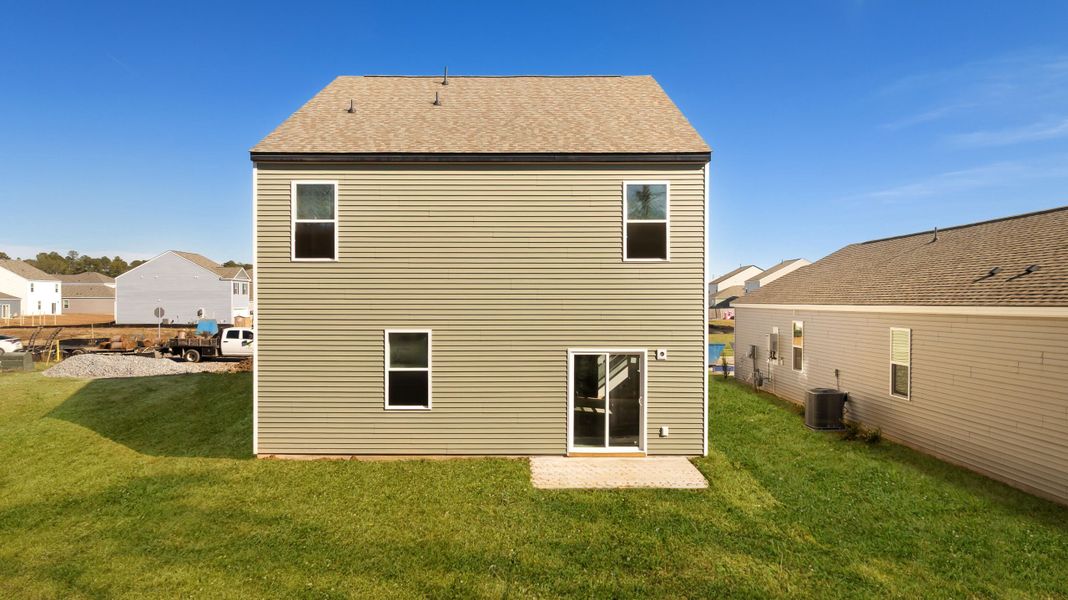 Exterior details and patio area of a home in Pine Hills at Cane Bay, Summerville (Image 3). Exterior details and patio area of a home in Pine Hills at Cane Bay, Summerville (Image 3).