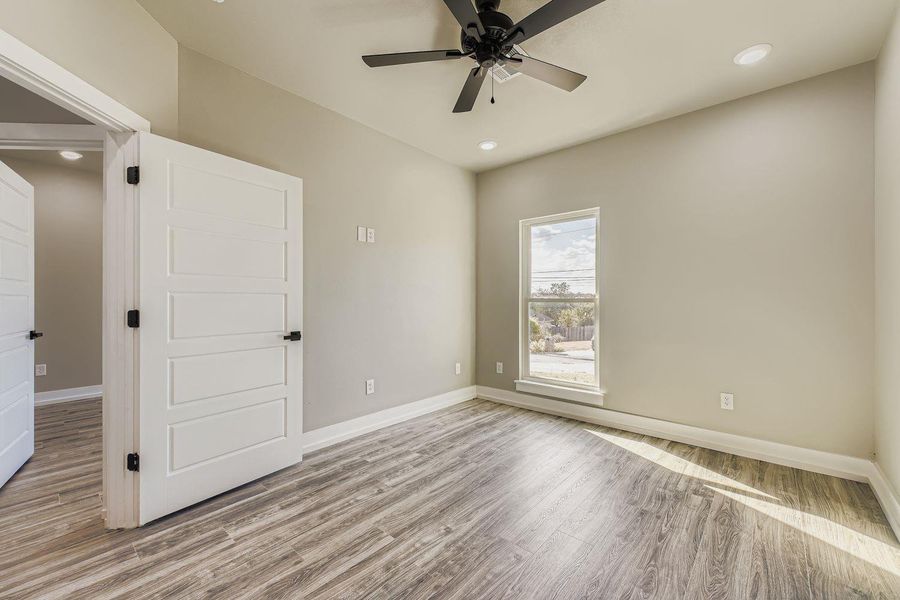Unfurnished bedroom featuring light wood-style floors, recessed lighting, and a ceiling fan