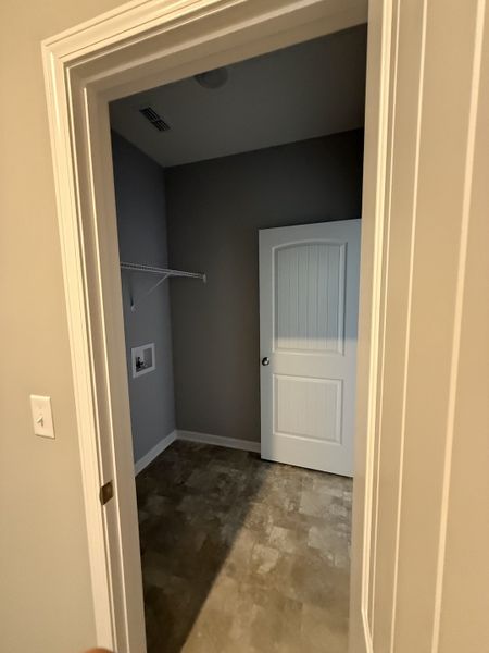 primary closet connects to the laundry room