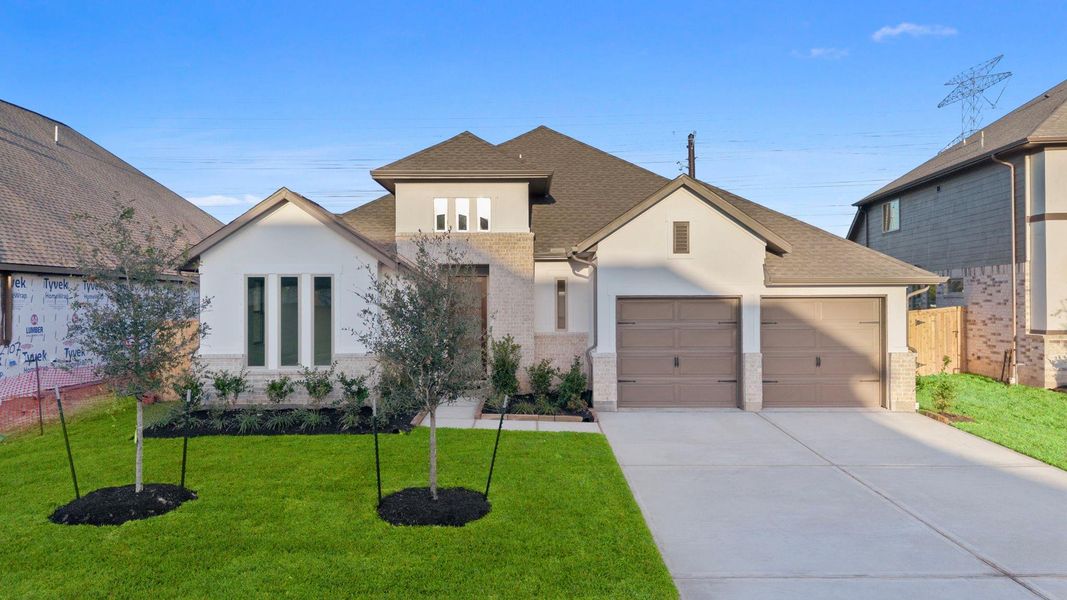 Front exterior of a new home in Coastal Point, League City, TX, highlighting curb appeal (Image 2).
