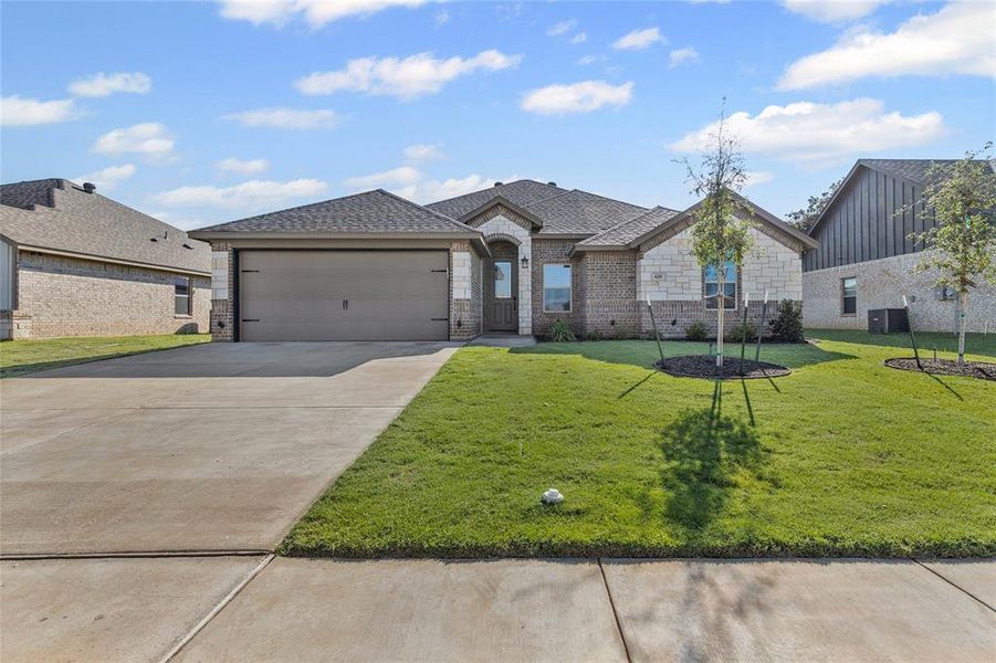 Front exterior of a new home in , Springtown, TX, highlighting curb appeal (Image 21).