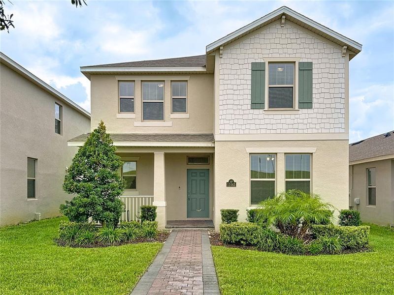 Front exterior of a new home in , Winter Garden, FL, highlighting curb appeal (Image 30).