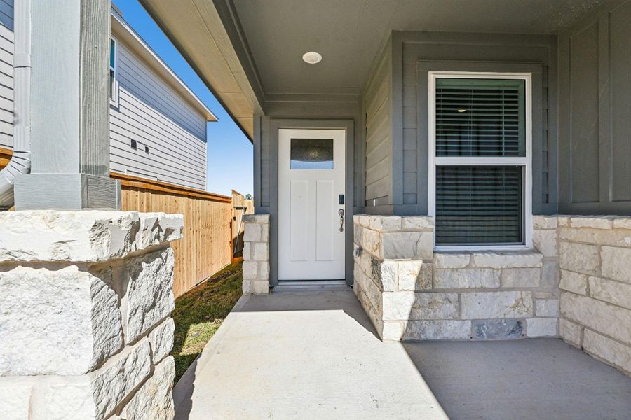 Exterior details and patio area of a home in Granger Pointe - Traditional Series, Conroe (Image 3).