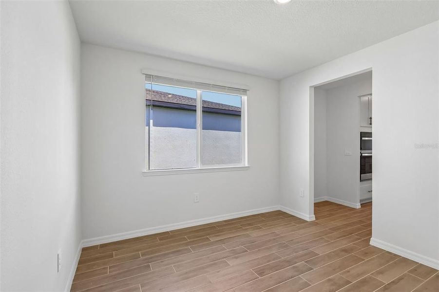 Spacious, unfurnished interior of a new home in The Grove at Stuart Crossing - Signature Series, Bartow (Image 19).