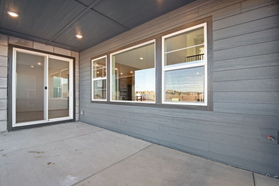 Exterior details and patio area of a home in Sterling Ranch, Littleton (Image 24).