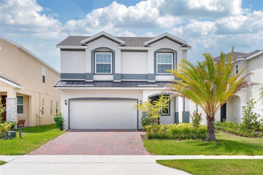 Front exterior of a new home in , Clermont, FL, highlighting curb appeal (Image 19).