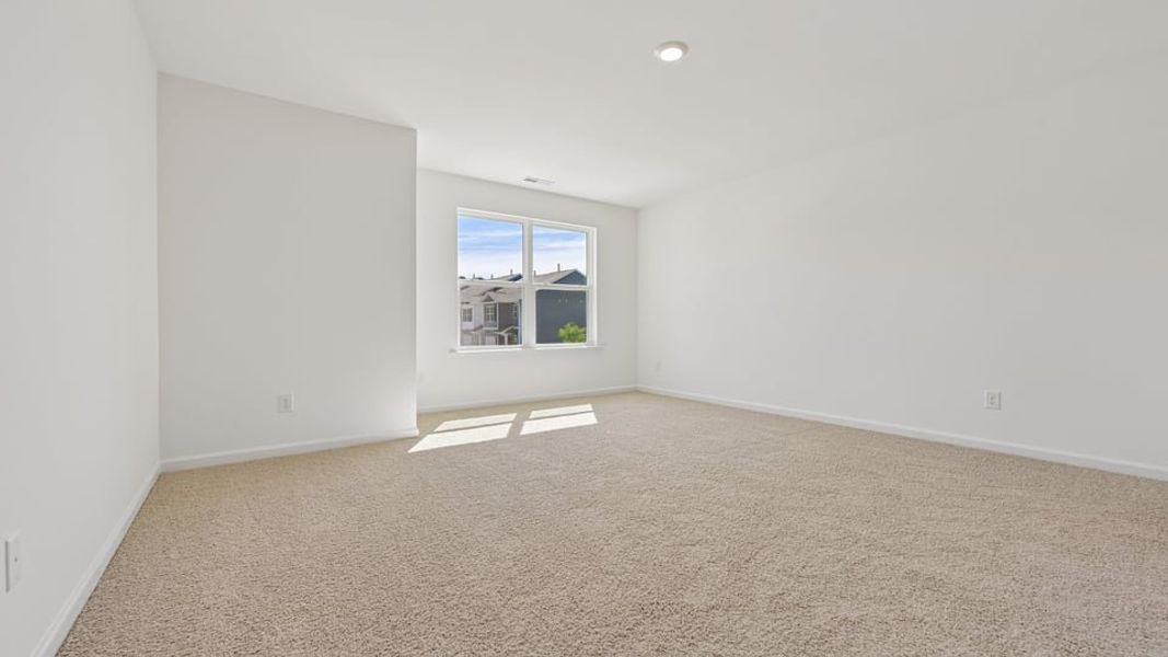 Spacious, unfurnished interior of a new home in The Townes at Belle Grove, Wendell (Image 9).