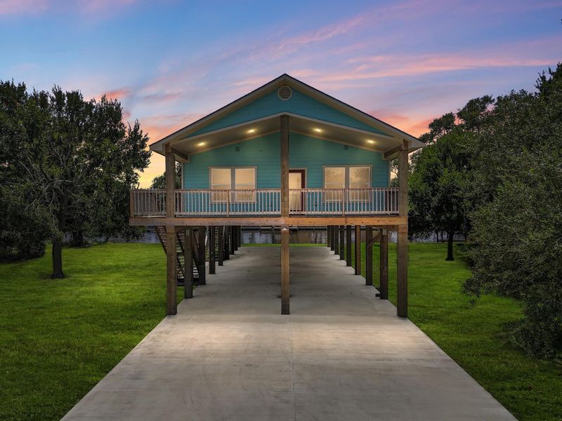 Front exterior of a new home in , Sargent, TX, highlighting curb appeal (Image 1). Front exterior of a new home in , Sargent, TX, highlighting curb appeal (Image 1).