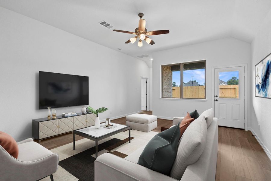 Your family room has ample space to entertain family and friends. This space features beautiful floors, fresh paint, ceiling fan with lighting, and high ceilings. Your family room has ample space to entertain family and friends. This space features beautiful floors, fresh paint, ceiling fan with lighting, and high ceilings.